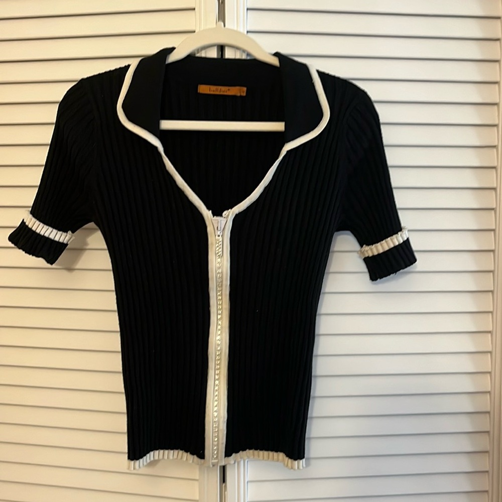 Belldini. . Black w/white trim Zippered front , collared sweater size M